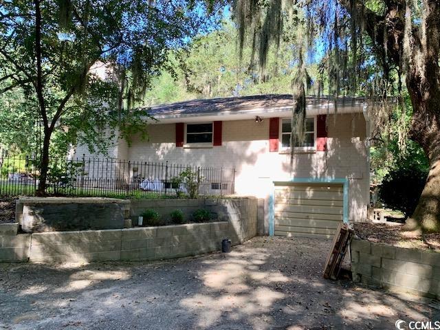 48 Sandpiper Lane, Unit 48 SANDPIPER LANE Georgetown, SC 29440 - Photo 9 of 10 View of front of house with driveway and a garage