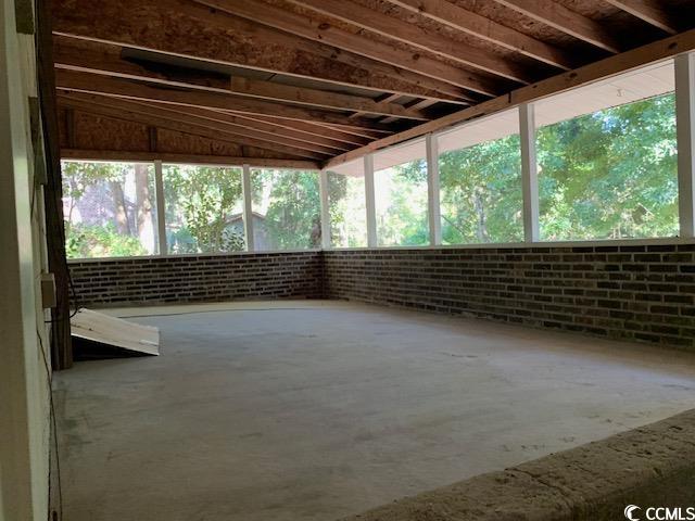 48 Sandpiper Lane, Unit 48 SANDPIPER LANE Georgetown, SC 29440 - Photo 10 of 10 Screened Porch overlooking back yard featuring vaulted ceiling and concrete floors