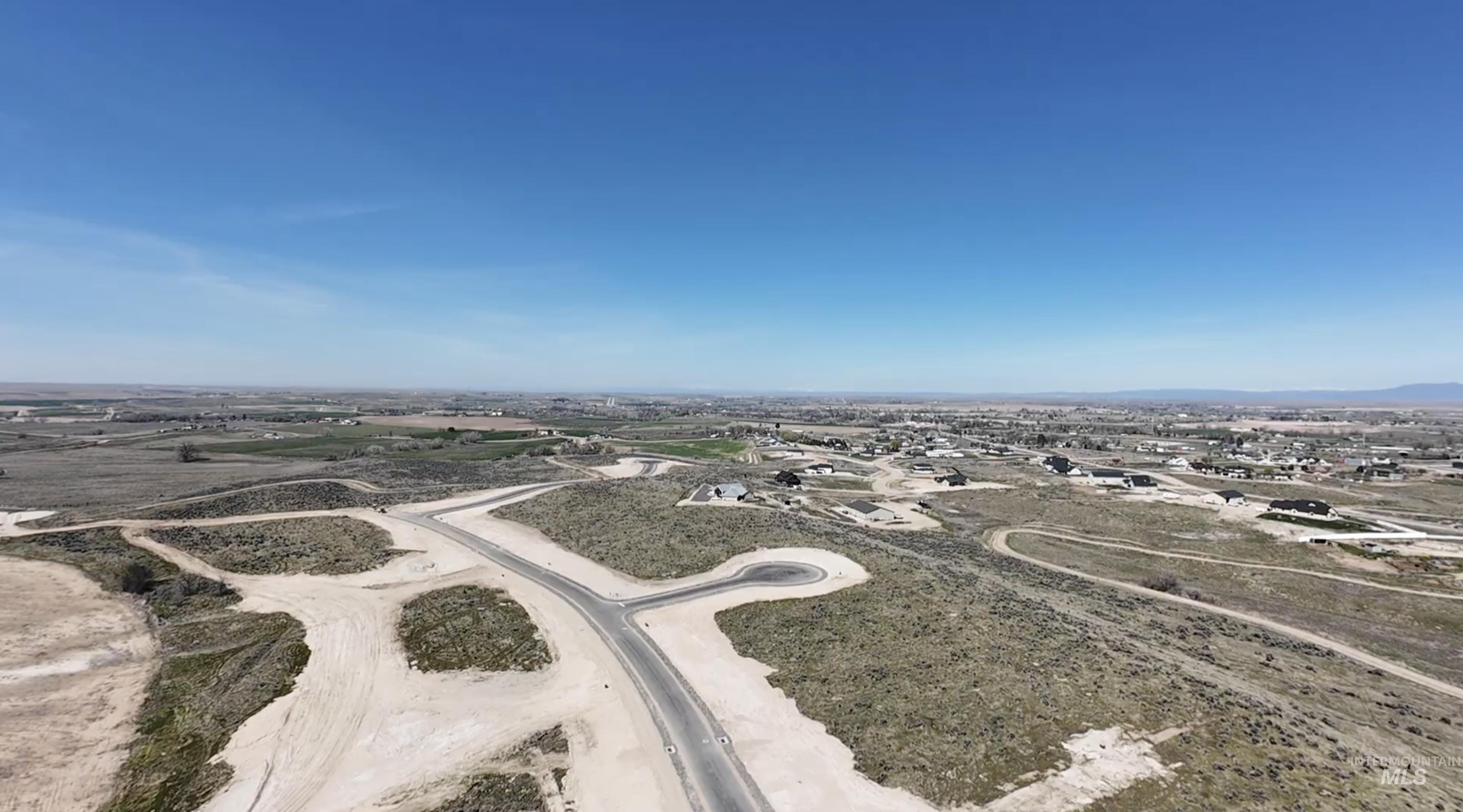 27730 Commerce Comet Way Caldwell, ID 83607 - Photo 11 of 18 Aerial view of a mountainous background