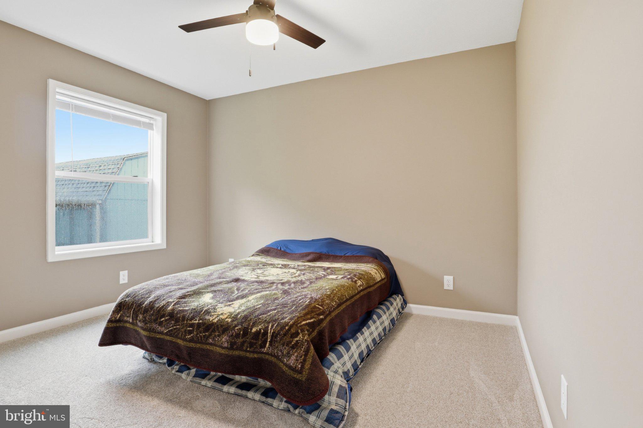 491 Garvine Mill Road Fawn Grove, PA 17321 - Photo 16 of 47 a bedroom with a bed and window