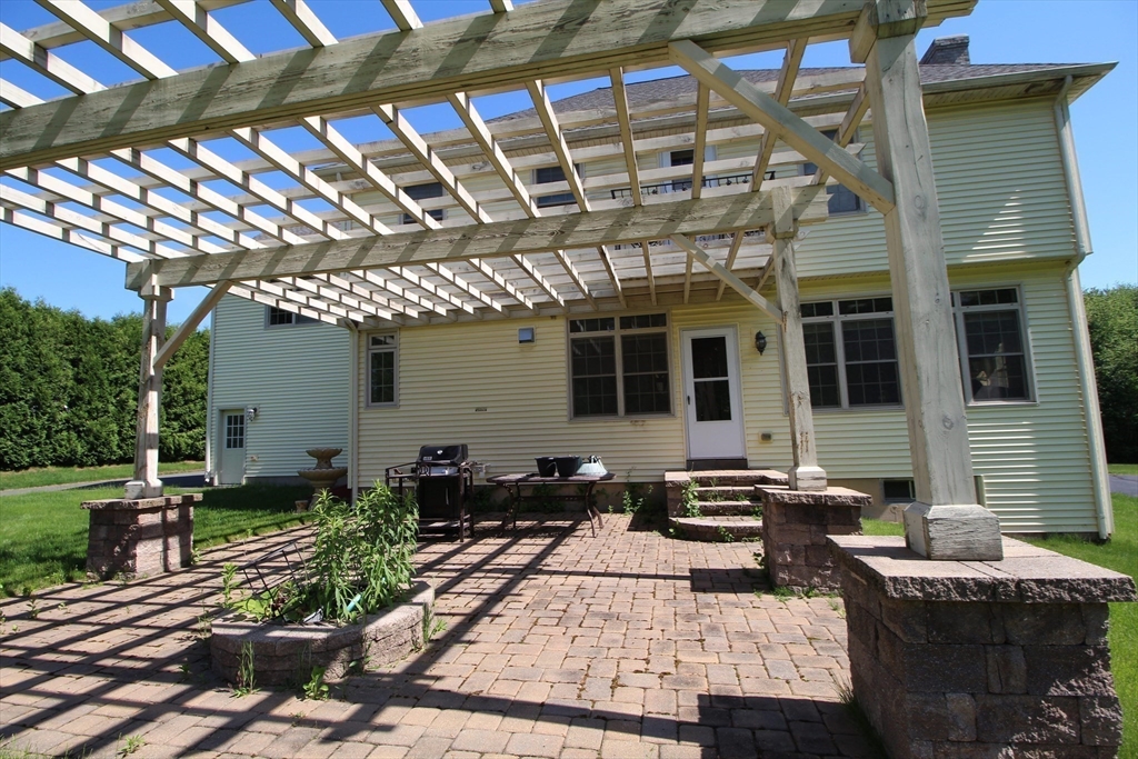 5 Gableview Lane Southwick, MA 01077 - Photo 12 of 41 a building outdoor space with patio furniture and potted plants