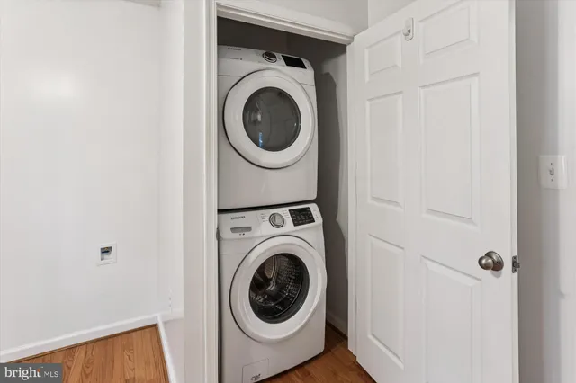 a view of a storage and utility room with washer and dryer