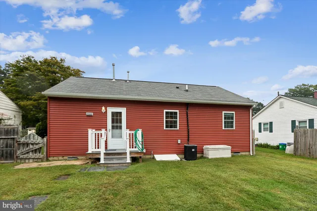 a roof deck with table and chairs
