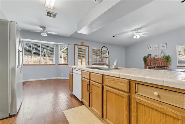 a bathroom with a sink a mirror and a shower