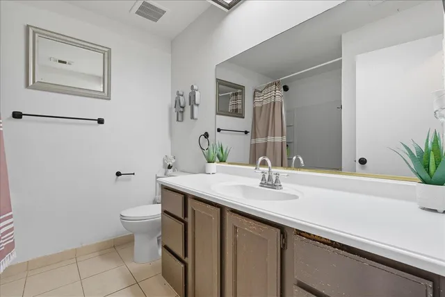 a bathroom with a sink a toilet and tub