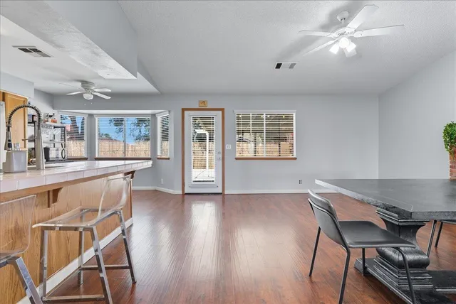 a view of a dining room with furniture window and wooden floor