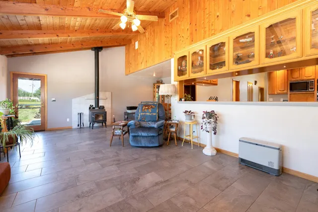 a view of a patio with dining table and chairs