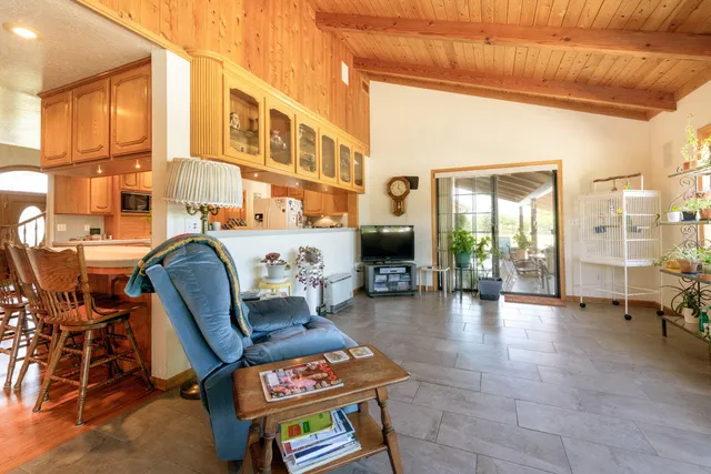 a outdoor living space with furniture and a floor to ceiling window