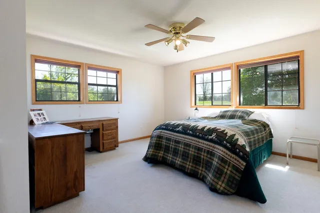 a bedroom with a bed and a table