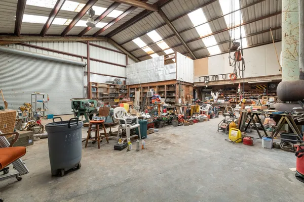 a view of a storage room with a table and chairs