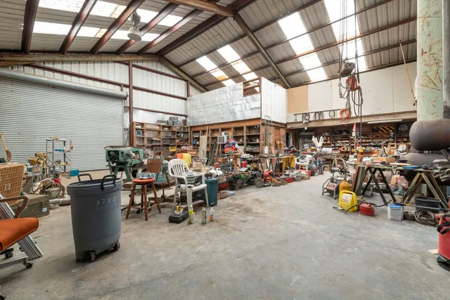 a view of a storage room with a table and chairs