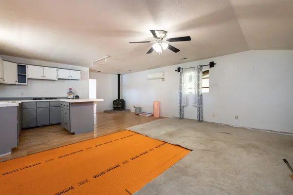 a kitchen with a sink stove and cabinets