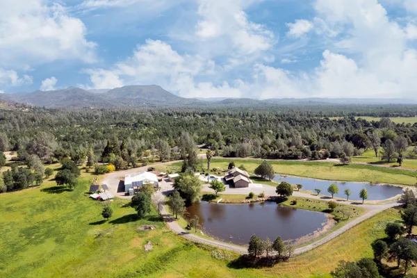 a view of a swimming pool with a table and chairs
