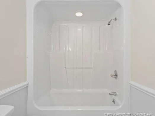 a close view of a bathtub in a bathroom