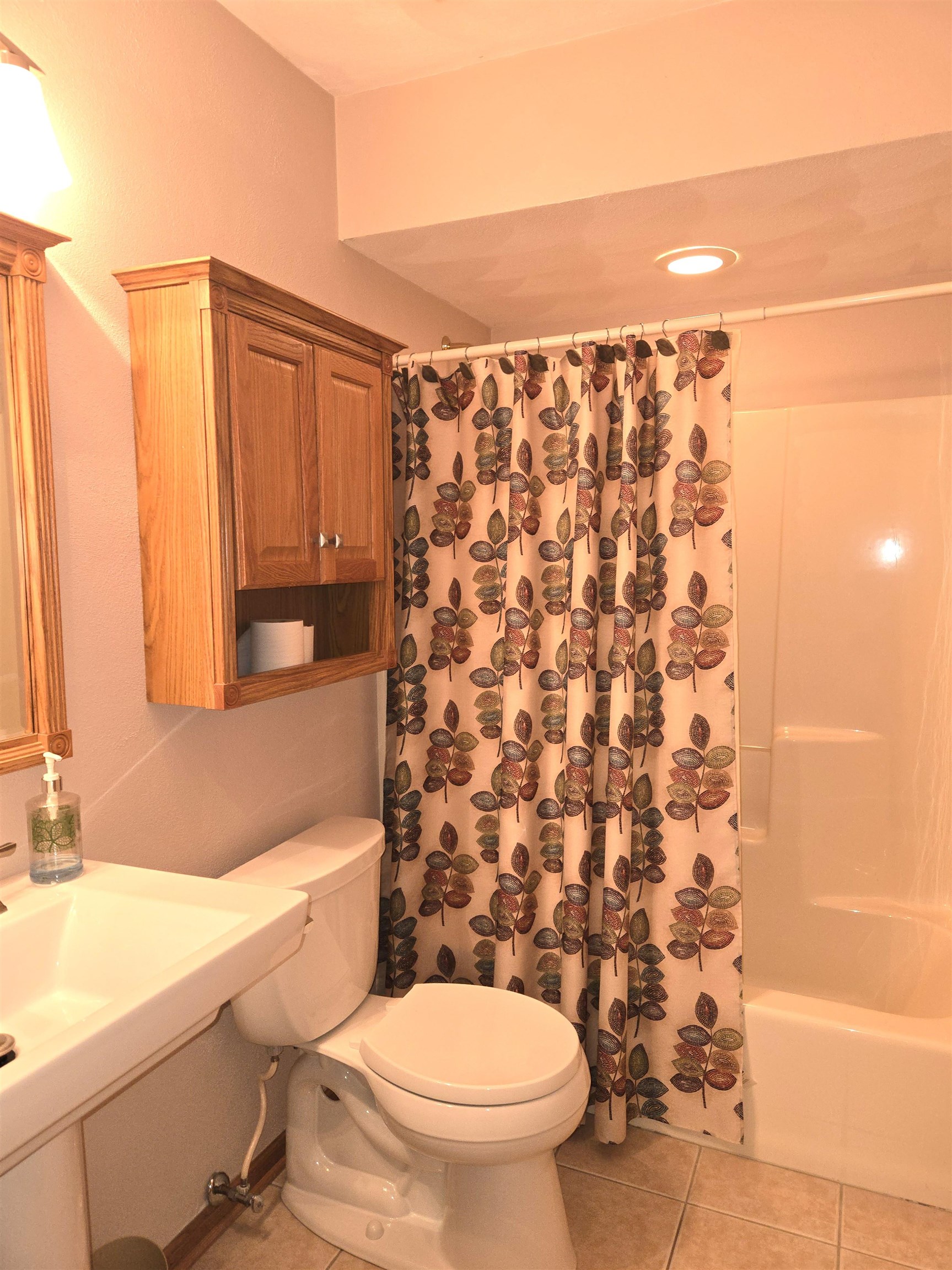2862 Dourdan Road Belvidere, IL 61008 - Photo 18 of 28 a bathroom with a toilet and a shower curtain