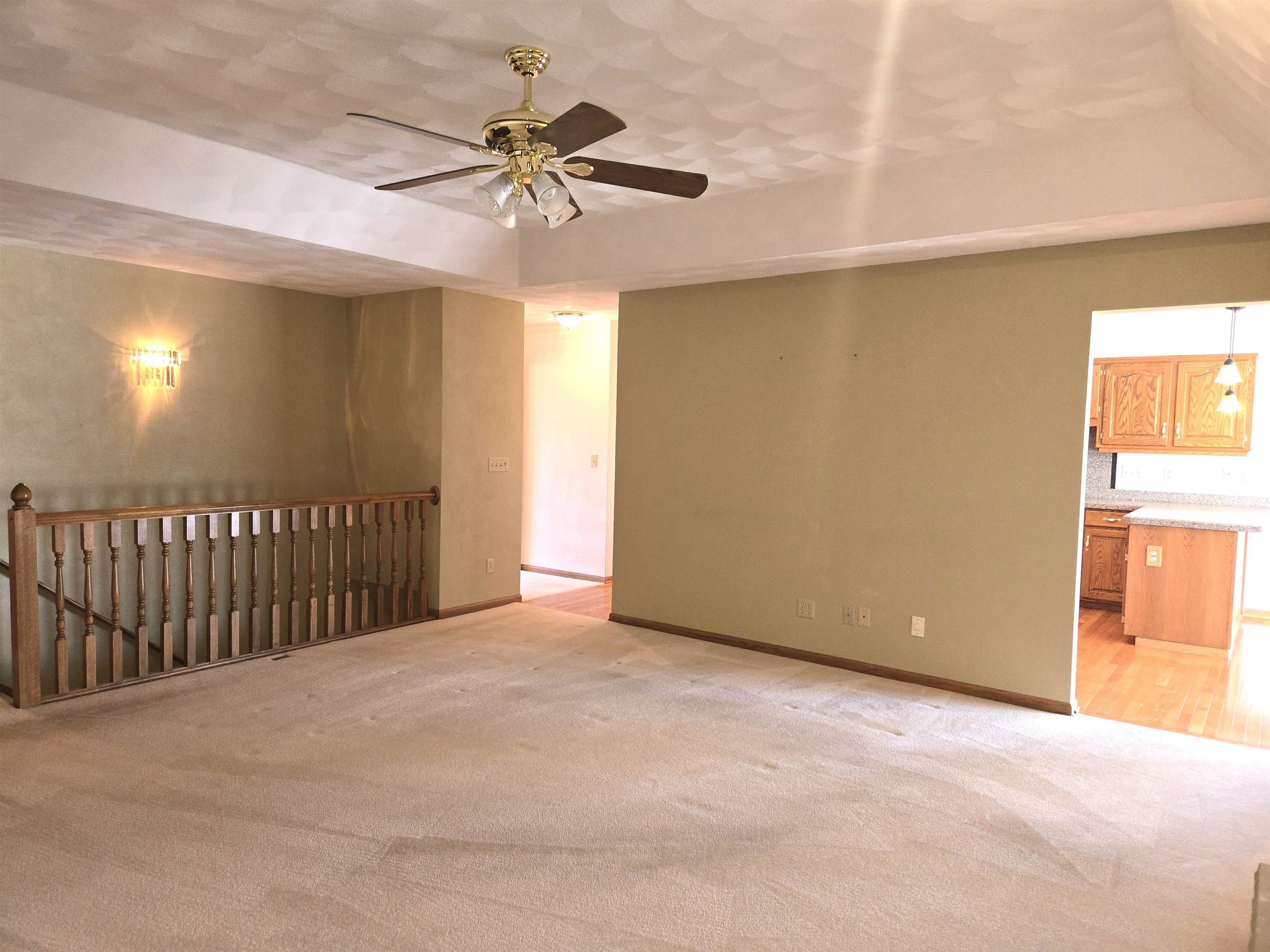 2862 Dourdan Road Belvidere, IL 61008 - Photo 8 of 28 a view of a livingroom with a ceiling fan and window