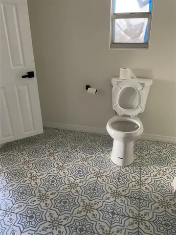 a bathroom with a toilet and a sink