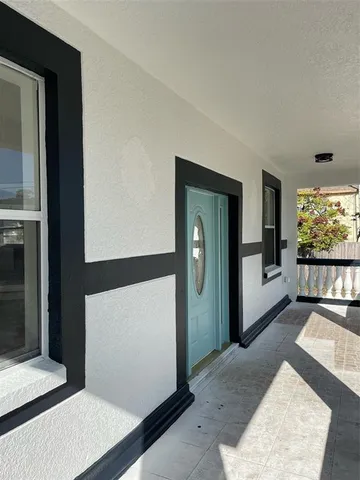 a view of an empty room and window