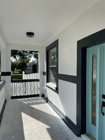 a view of a living room and a balcony