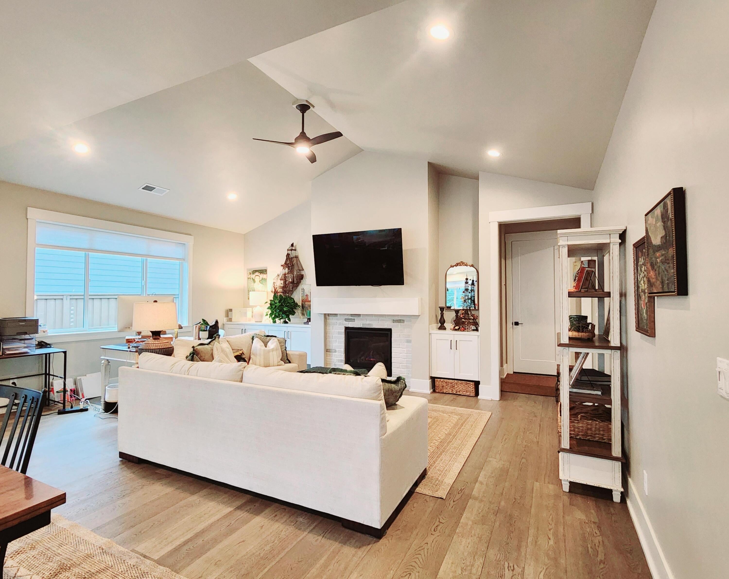 Great room has wood floors.