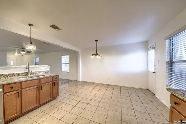 a view of a kitchen with a sink and a window