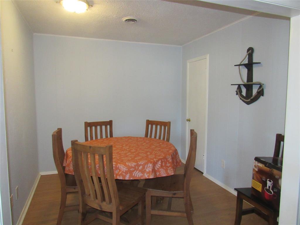 498 Homesite Road Pottsboro, TX 75076 - Photo 14 of 35 a view of a room with furniture and wooden floor