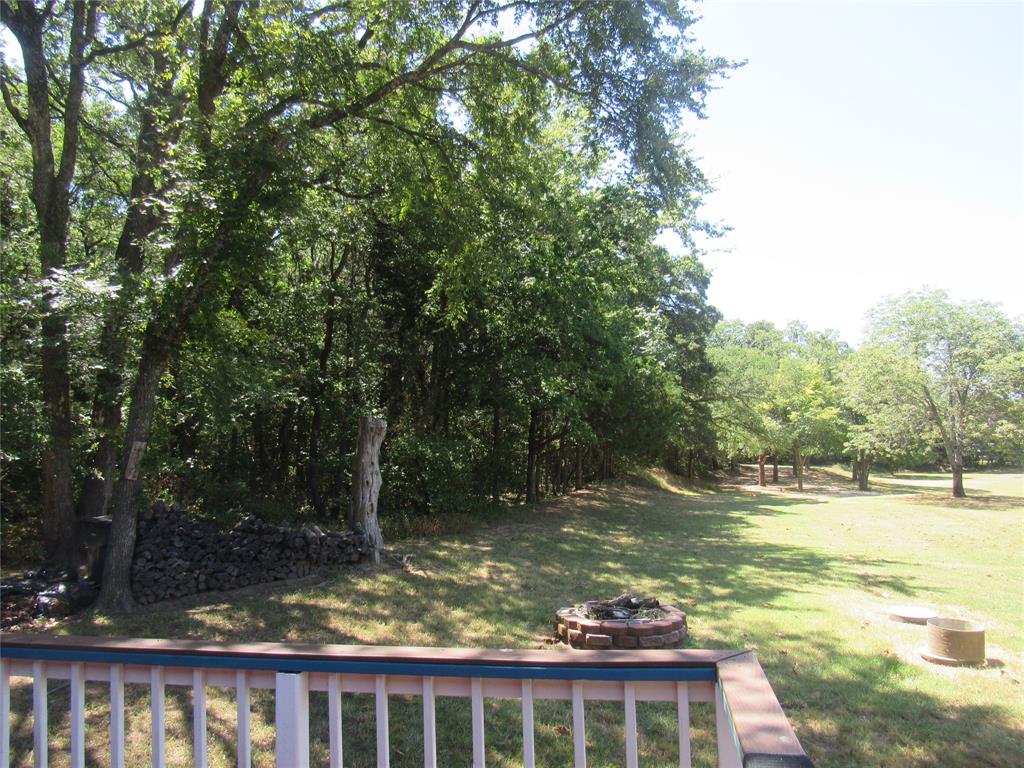 498 Homesite Road Pottsboro, TX 75076 - Photo 32 of 35 a view of a large body of water with a house in the background