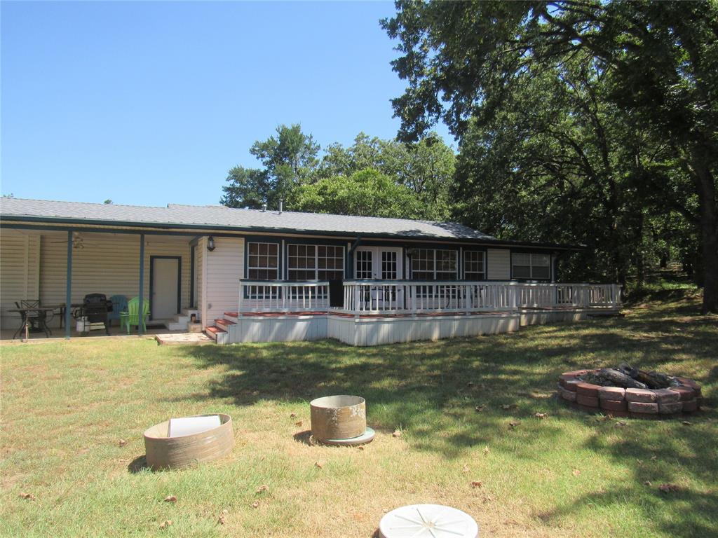 498 Homesite Road Pottsboro, TX 75076 - Photo 7 of 35 a view of a house with swimming pool and sitting area