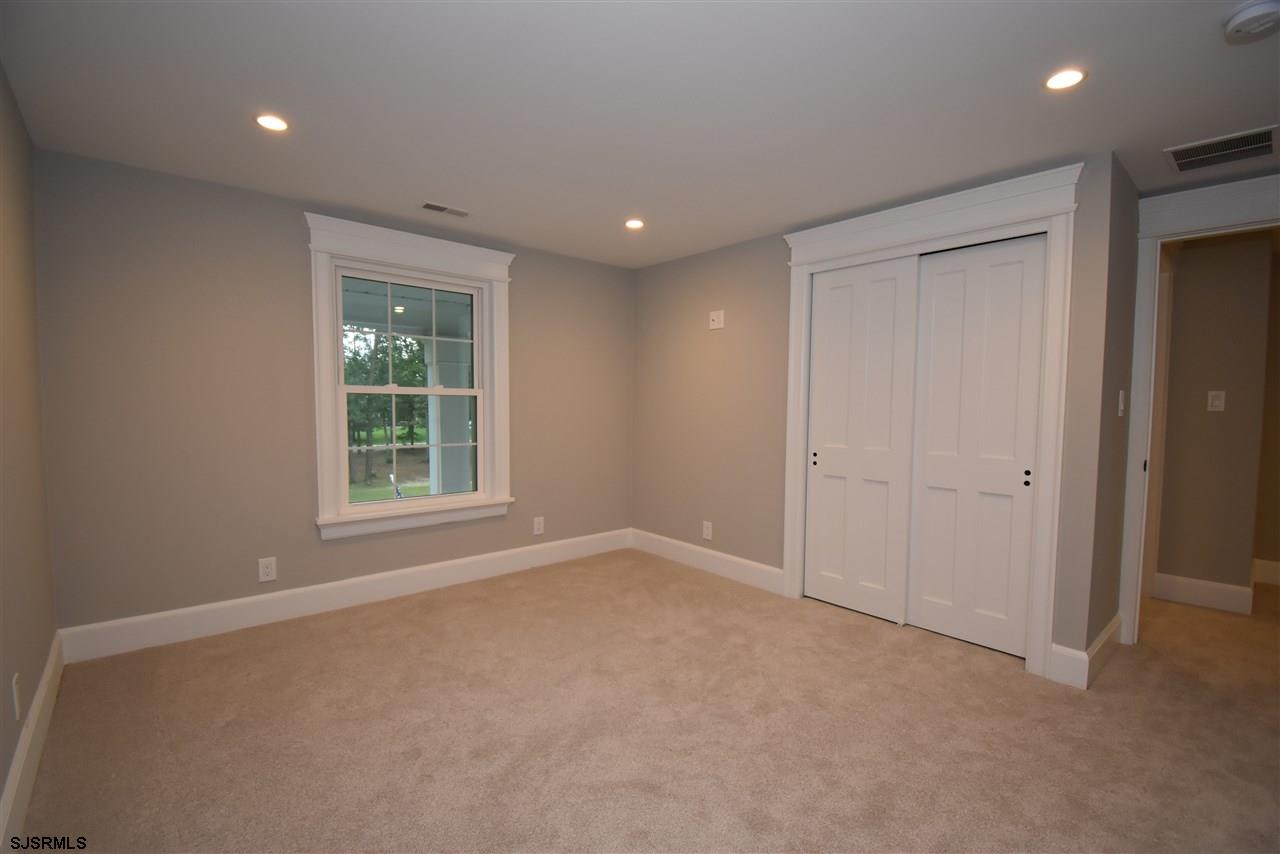 419 Chestnut Neck Road Port Republic, NJ 08241 - Photo 18 of 25 an empty room with windows and closet