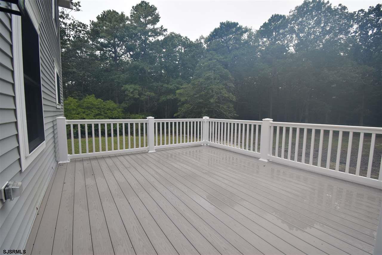 419 Chestnut Neck Road Port Republic, NJ 08241 - Photo 22 of 25 a view of backyard with deck and wooden floor