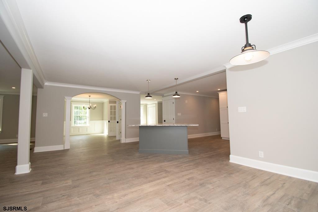 419 Chestnut Neck Road Port Republic, NJ 08241 - Photo 6 of 25 an empty room with wooden floor and windows