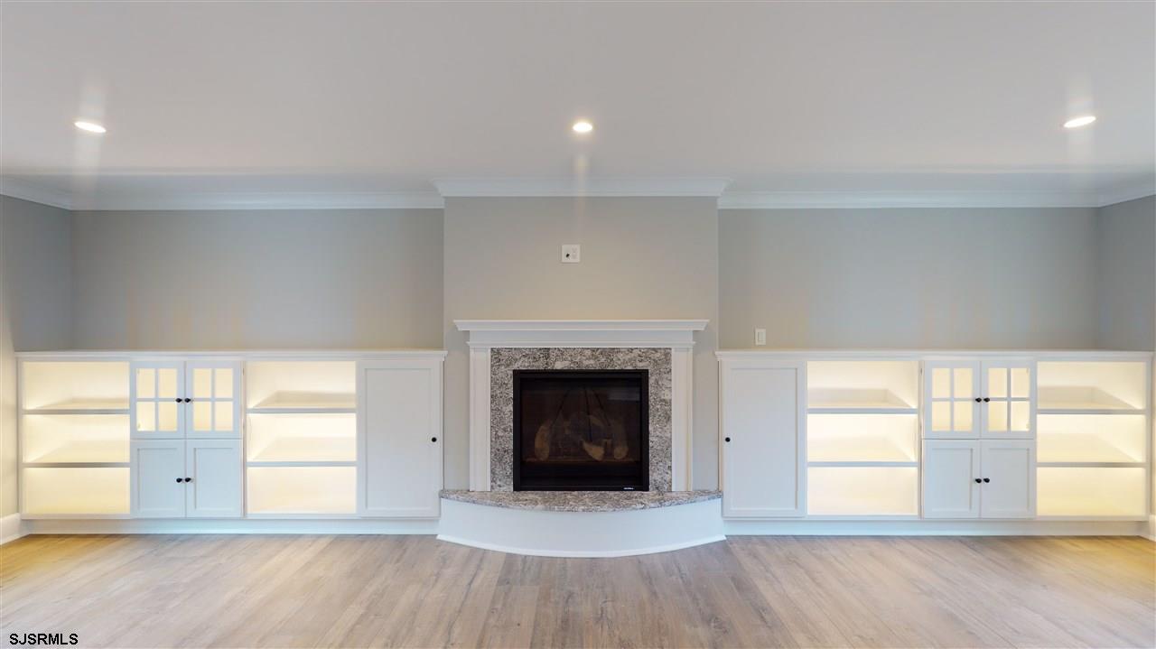 419 Chestnut Neck Road Port Republic, NJ 08241 - Photo 7 of 25 an empty room with windows and fireplace