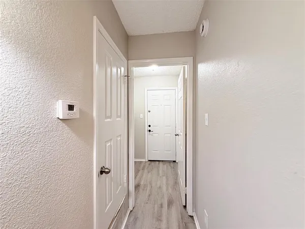 a view of a bathroom from a hallway