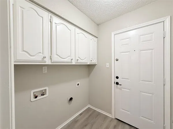 a view of cabinets with wooden floor