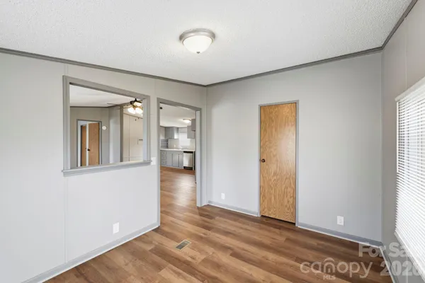 a view of an empty room and window