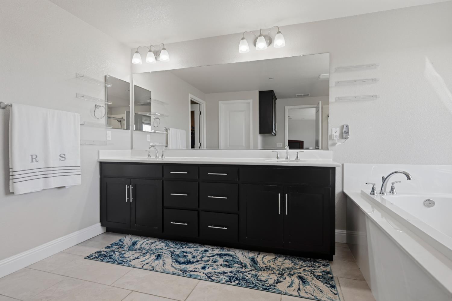 2012 Van Ruiten Drive Lodi, CA 95242 - Photo 33 of 48 a bathroom with a sink double vanity and a mirror