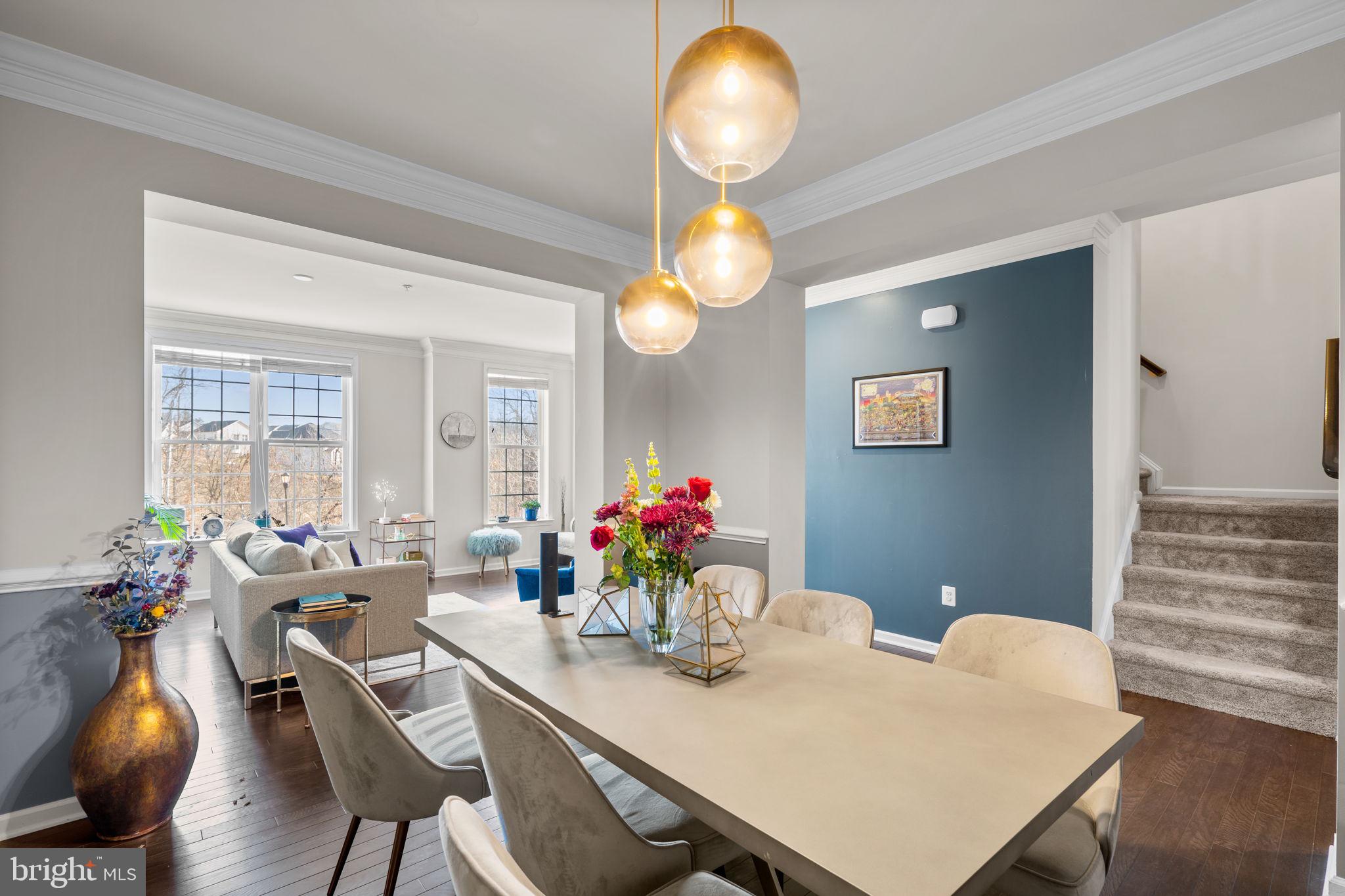 4323 Spring Foal Court Upper Marlboro, MD 20772 - Photo 11 of 49 a view of a dining room with furniture and wooden floor