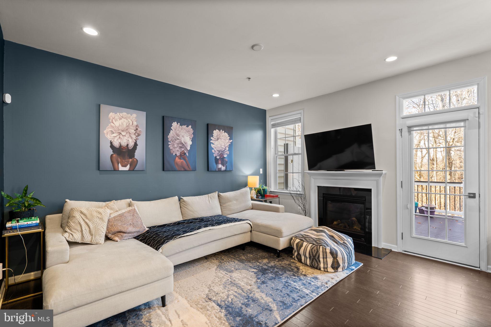 4323 Spring Foal Court Upper Marlboro, MD 20772 - Photo 18 of 49 a living room with furniture fireplace and a flat screen tv