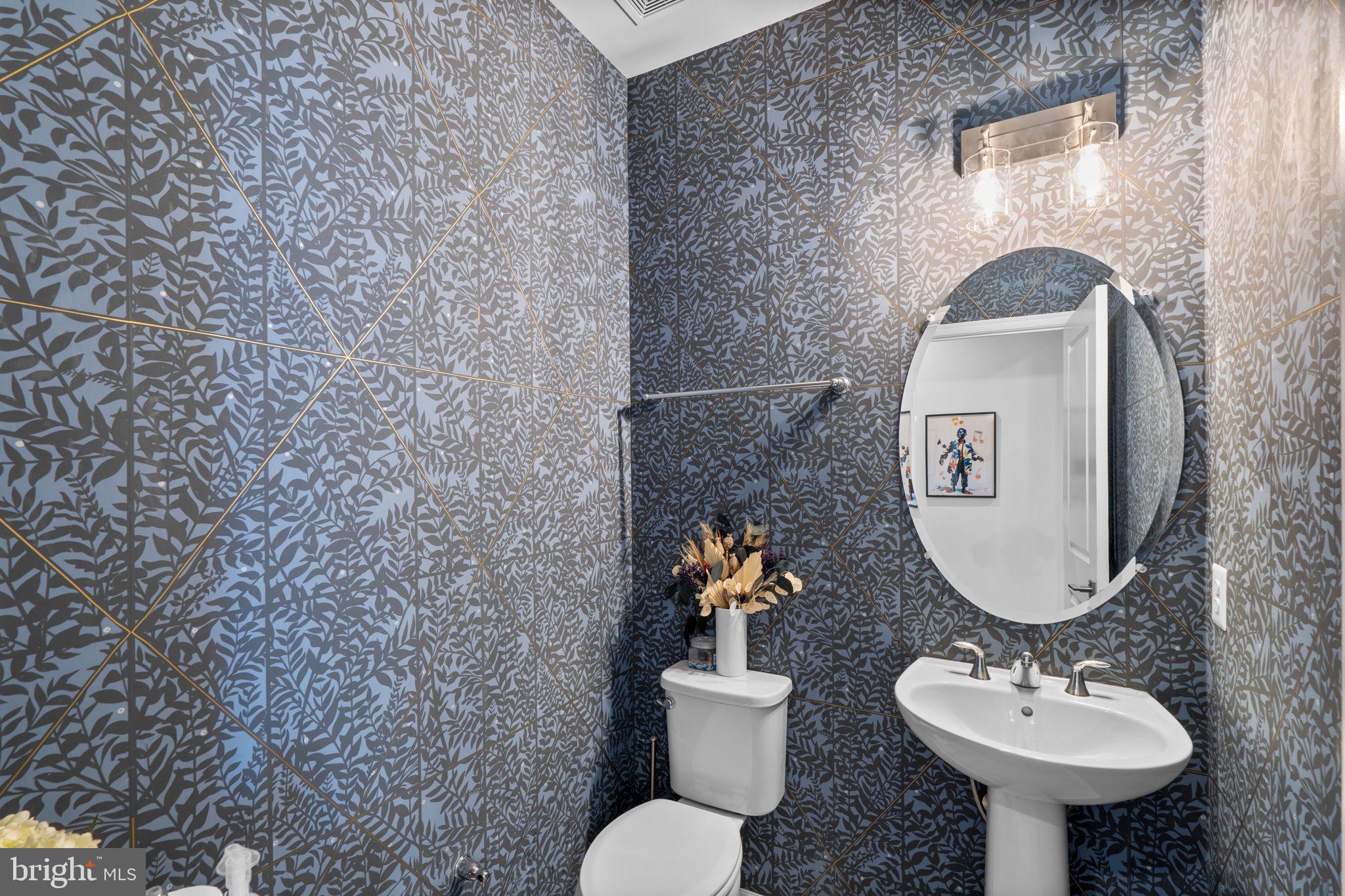 4323 Spring Foal Court Upper Marlboro, MD 20772 - Photo 21 of 49 a bathroom with a toilet sink and mirror