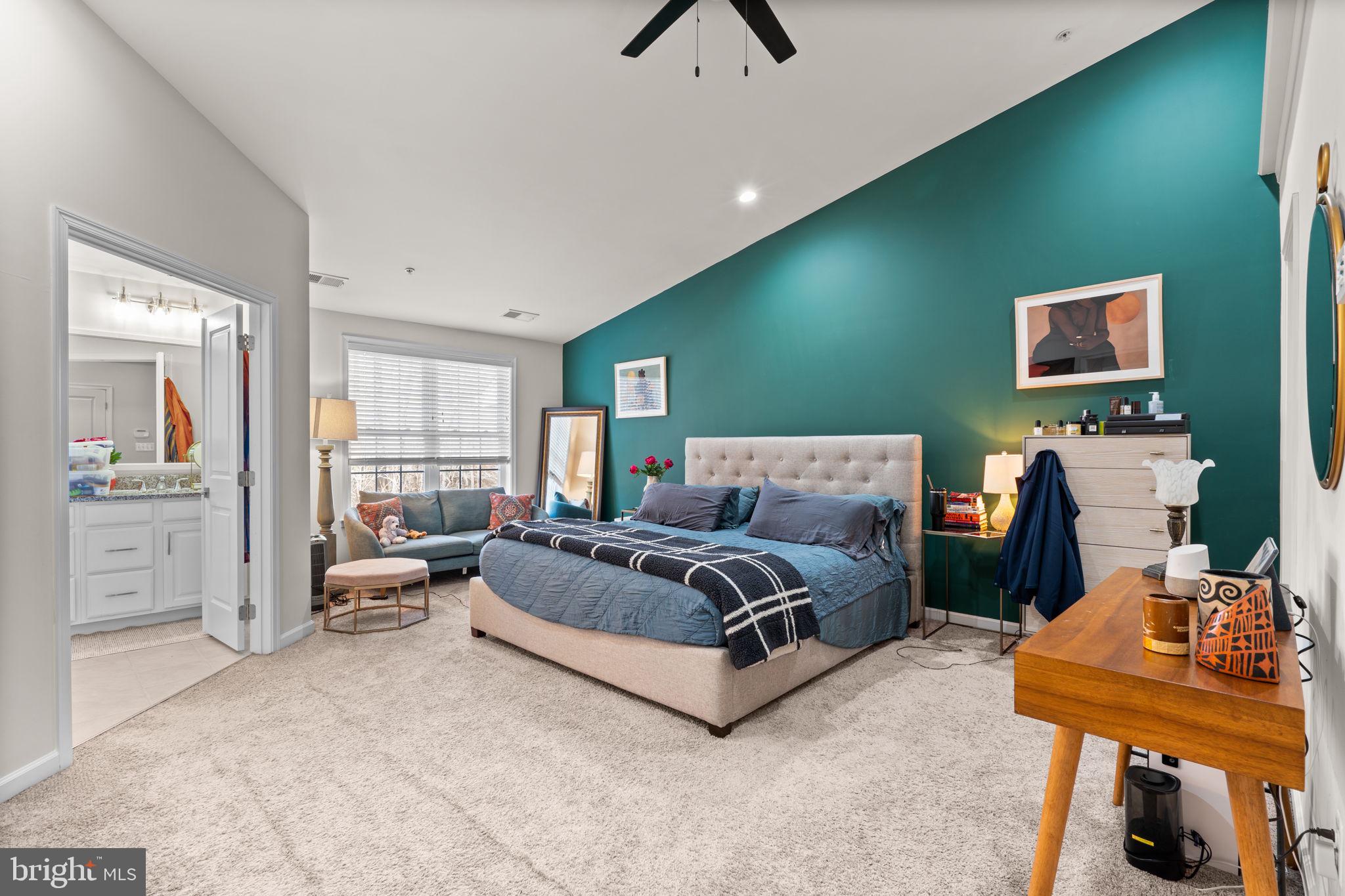 4323 Spring Foal Court Upper Marlboro, MD 20772 - Photo 22 of 49 a spacious bedroom with a bed and a table