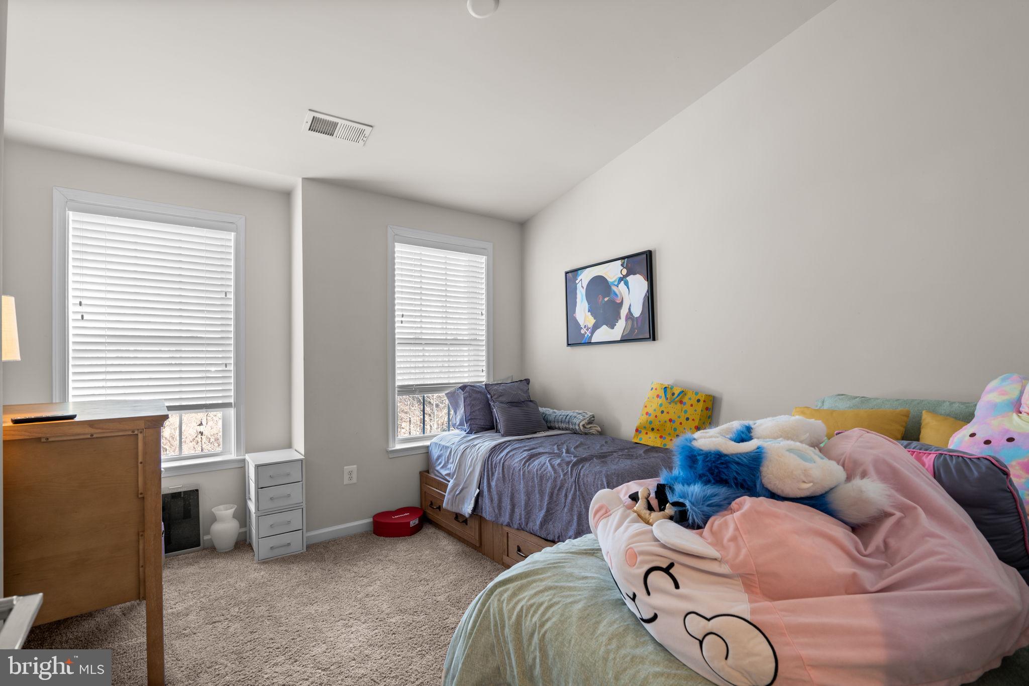 4323 Spring Foal Court Upper Marlboro, MD 20772 - Photo 32 of 49 a bedroom with two beds and a window