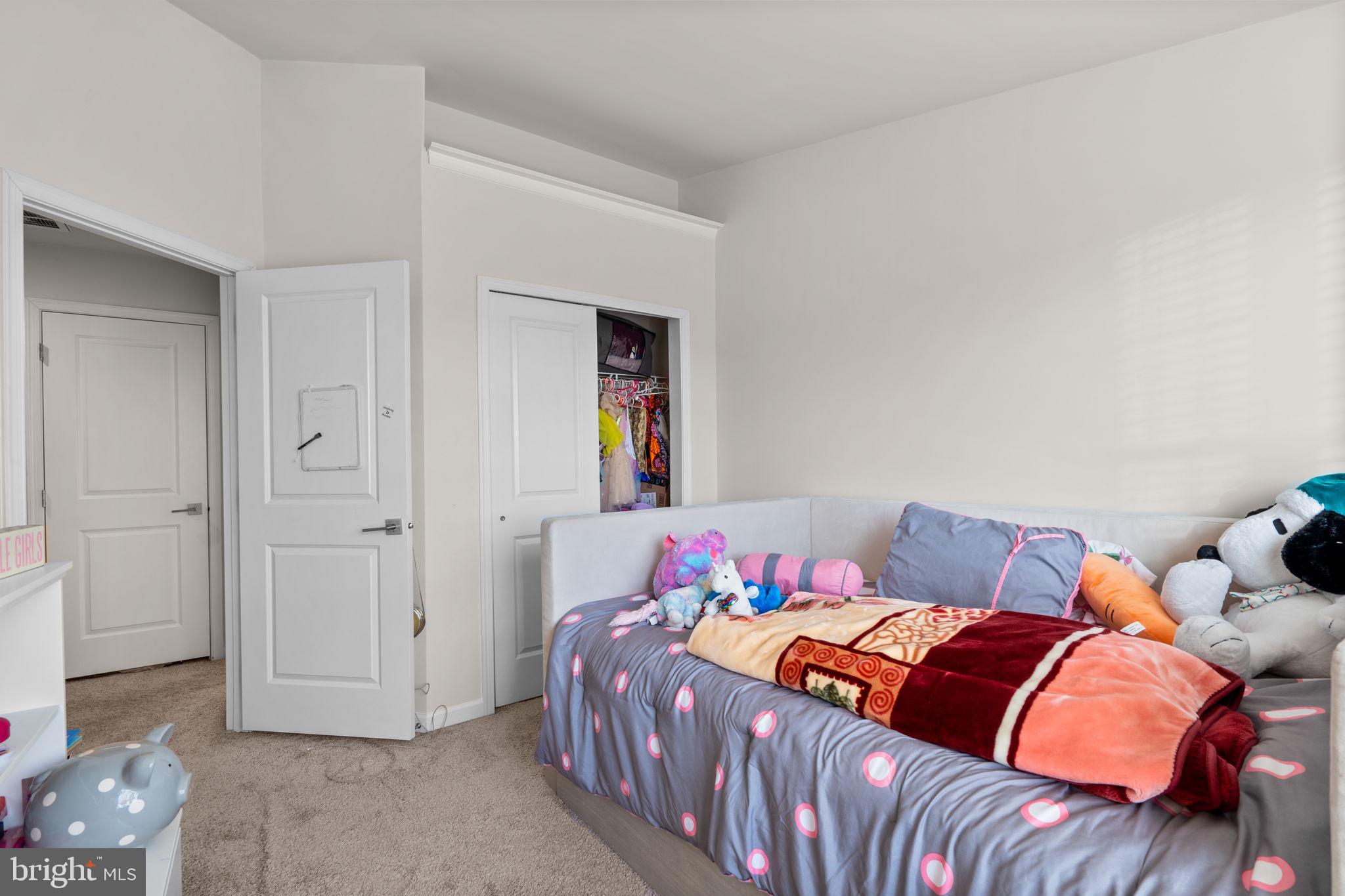 4323 Spring Foal Court Upper Marlboro, MD 20772 - Photo 35 of 49 a bedroom with a bed and a window