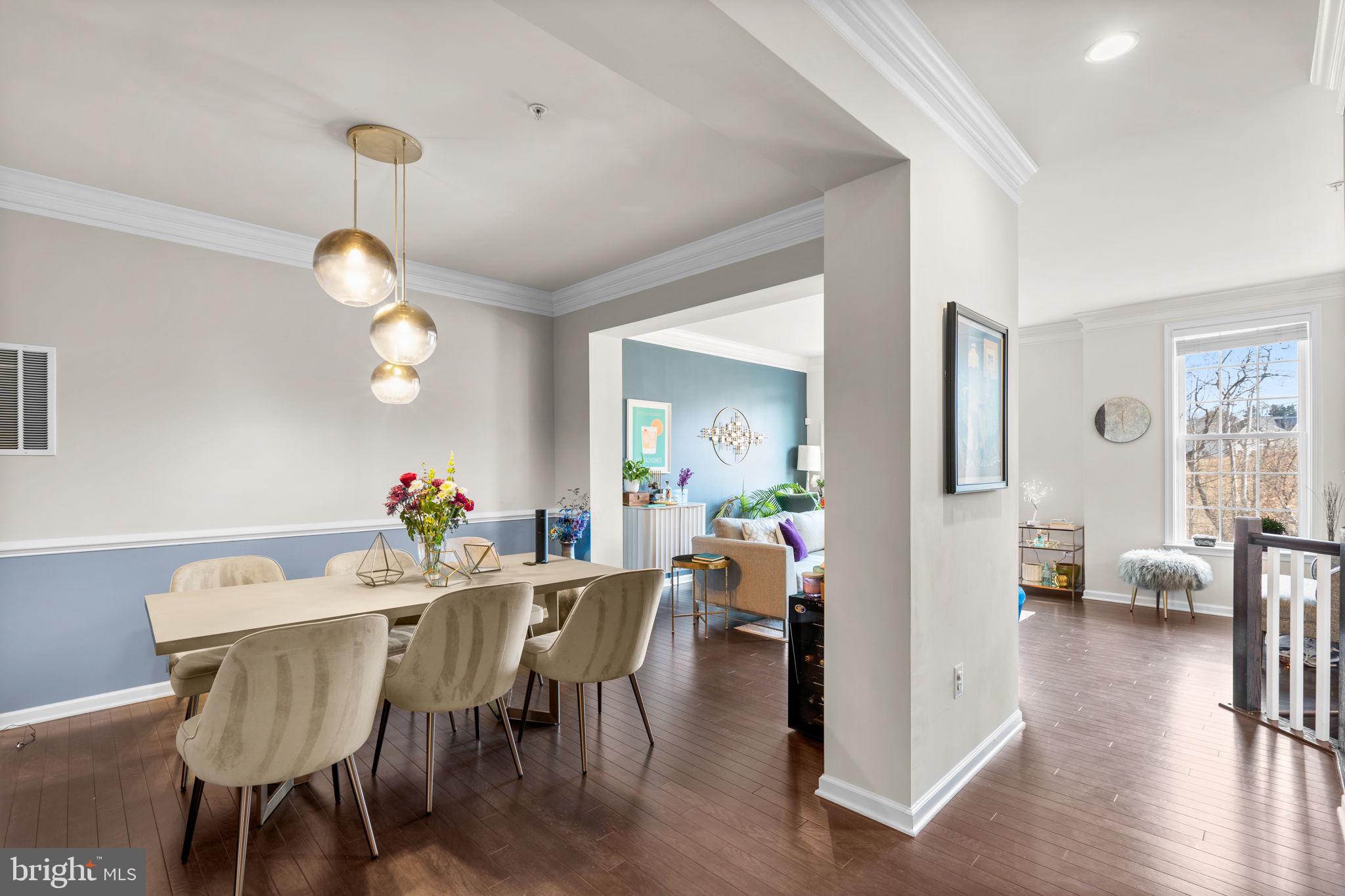 4323 Spring Foal Court Upper Marlboro, MD 20772 - Photo 10 of 49 a view of a dining room with furniture and wooden floor