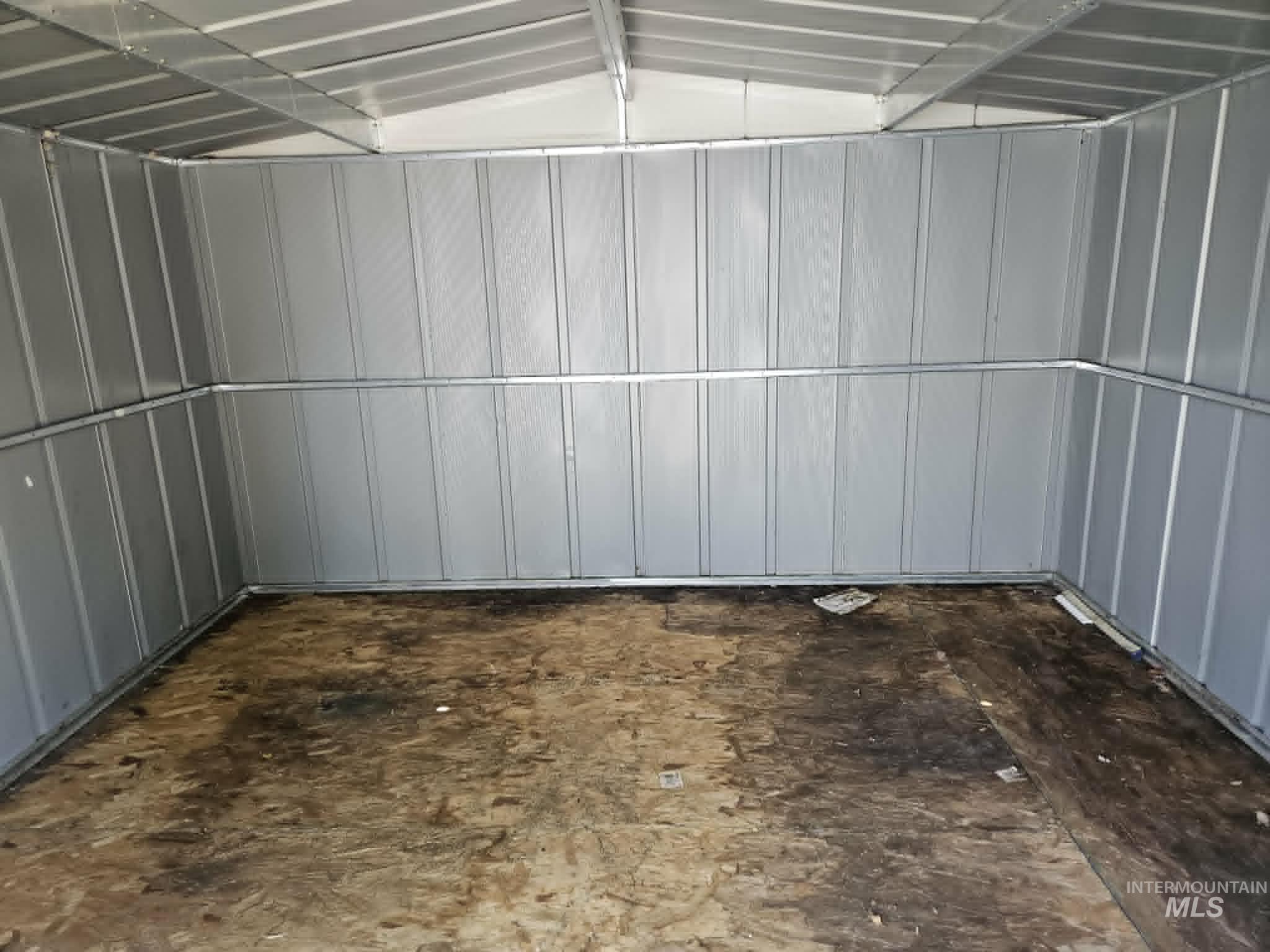 461 Greenleaf Street Boise, ID 83713 - Photo 16 of 19 Utility structure interior featuring corrugated metal walls, a metal-paneled ceiling, and engineered wood flooring
