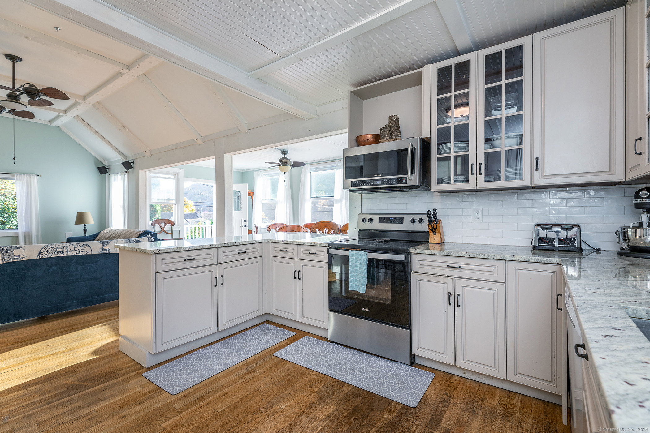 5 Windmill Road New Fairfield, CT 06812 - Photo 11 of 37 a kitchen with stainless steel appliances granite countertop a stove and a sink