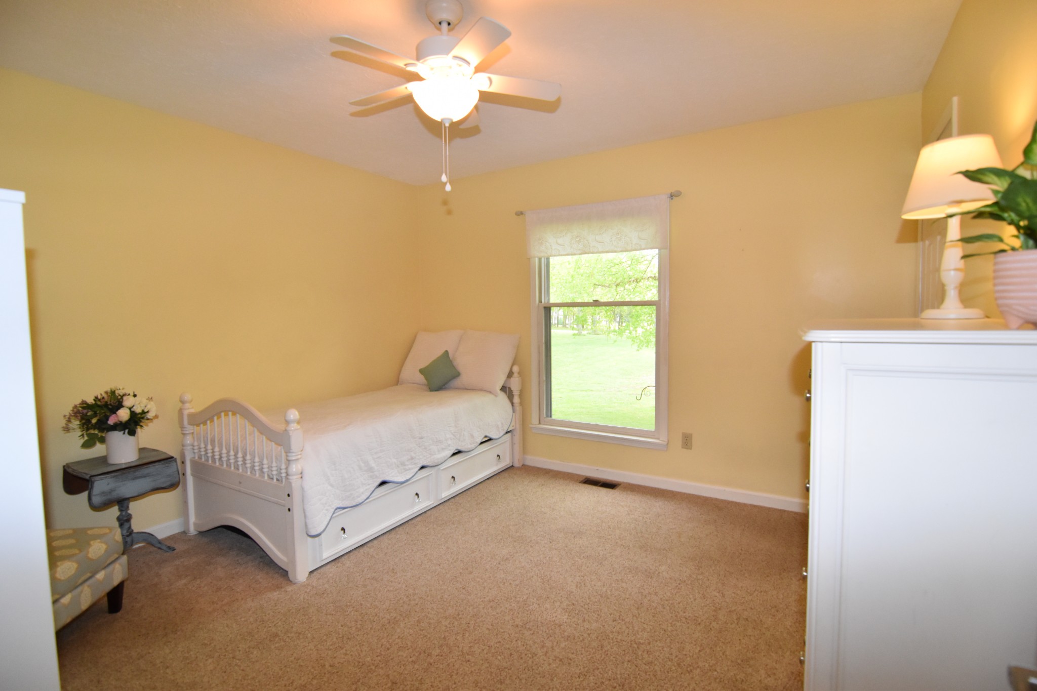 2513 Quarry Road Mount Juliet, TN 37122 - Photo 19 of 42 a bedroom with a bed and a chandelier