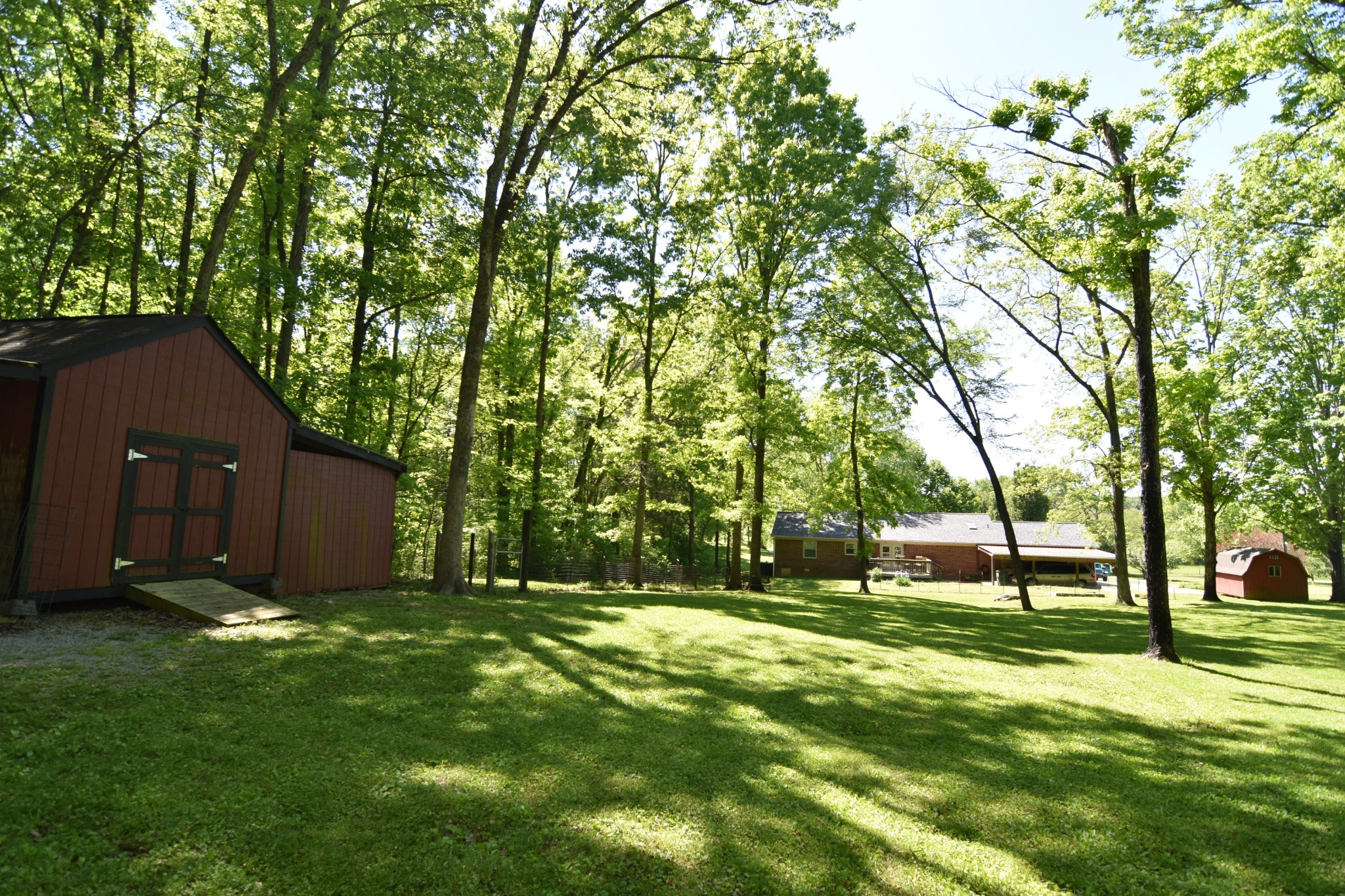 2513 Quarry Road Mount Juliet, TN 37122 - Photo 38 of 42 a backyard of a house with lots of green space and fountain