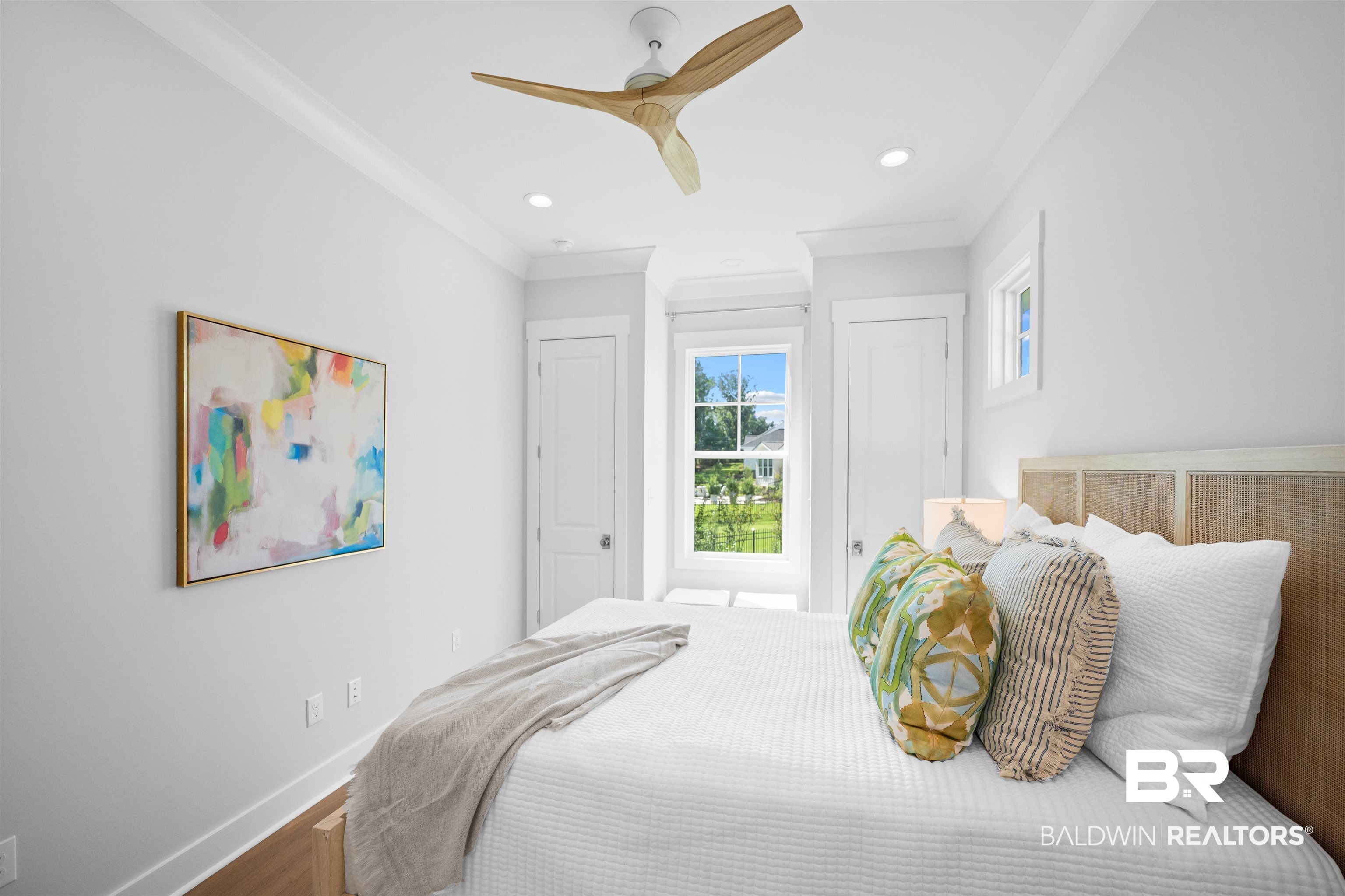 156 Hyacinth Street Fairhope, AL 36532 - Photo 55 of 61 Bedroom featuring multiple closets, ornamental molding, a ceiling fan, wood finished floors, and recessed lighting