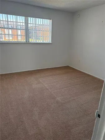 an empty room with closet area