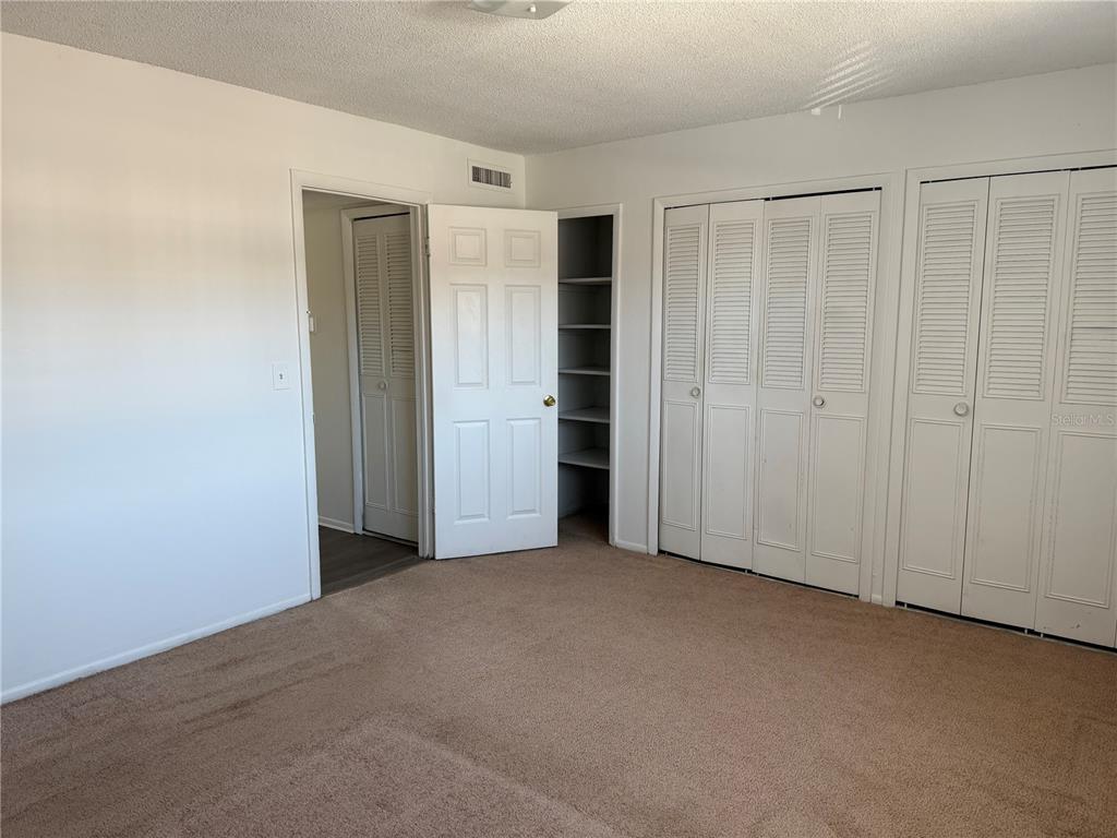 5317 Curry Ford Road, Unit 103 Orlando, FL 32812 - Photo 6 of 10 an empty room with closet area